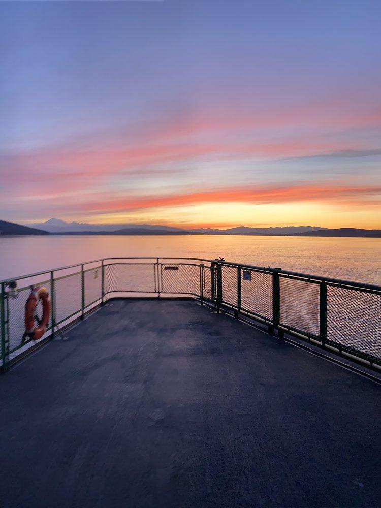 Sunrise from the outer deck of the ferry, the sky going pink over the water