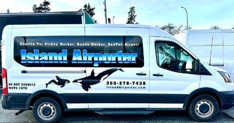 The Island Airporter shuttle with its orca decals